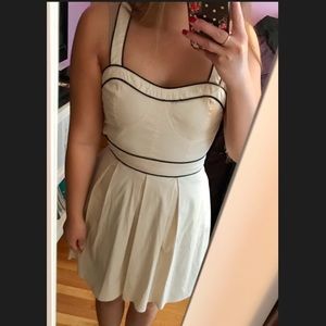 Ivory dress with black pipe lines